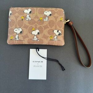 Coach X Peanuts Corner Zip Wristlet In Signature Canvas With Snoopy Print